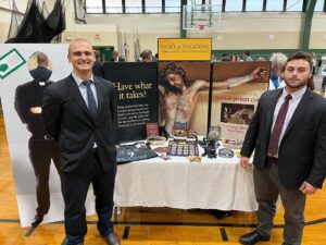 Seminarians Aidan Blanchette and Anthony Caruso represent Our Lady of Providence Seminary at the 2022 Bishop Hendricken College Fair in Warwick.